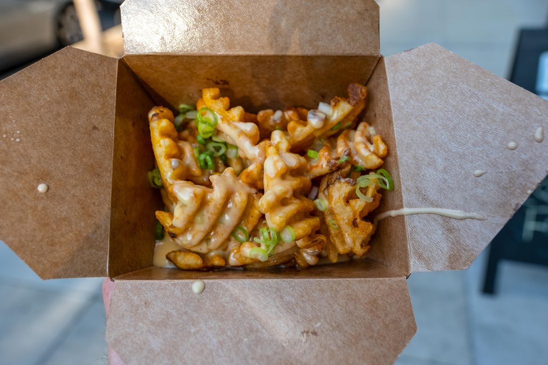 Waffle Fries with cheese sauce ($4)<br/>